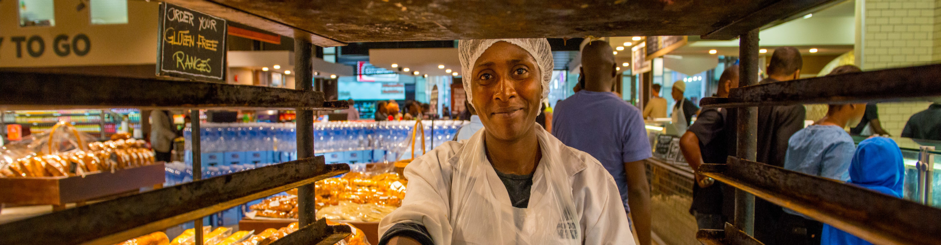 Worker at Food Lover’s Market in East Park Mall in Lusaka, Zambia. Photo: Arne Hoel/World Bank
