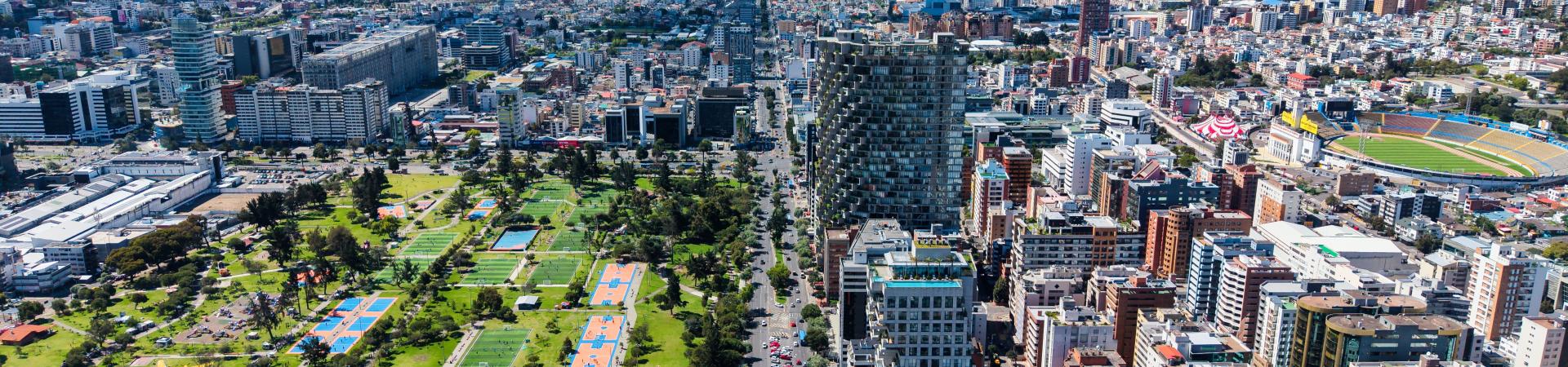 View of Quito city with green parks and modern buildings. Photo: Rodrigo/AdobeStock