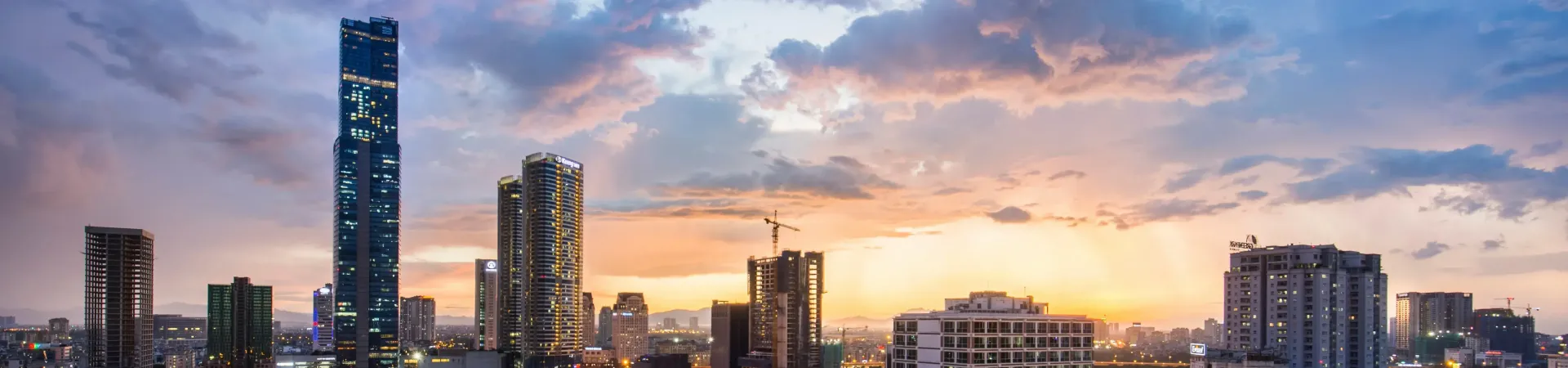 Many buildings shown during a sunset time